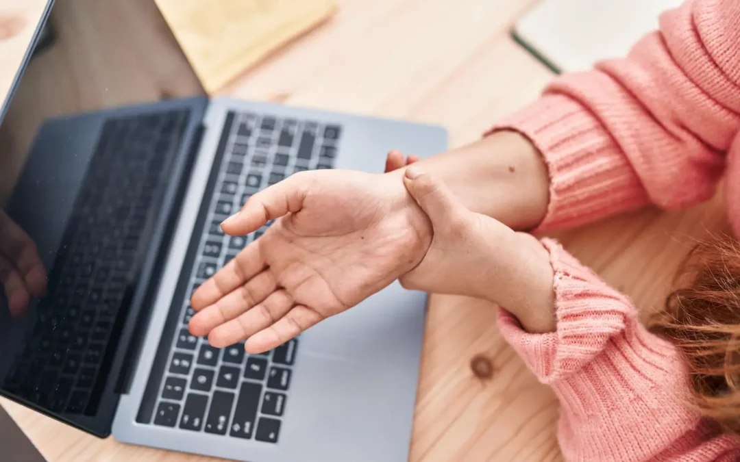 Manual osteopath treating carpal tunnel in a Calgary patient's wrist